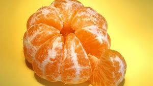 Peeled orange showing a slice is fraction 1/8 of whole.